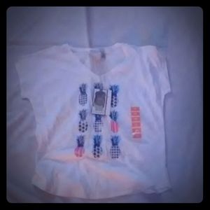 A white t-shirt with pineapples on it